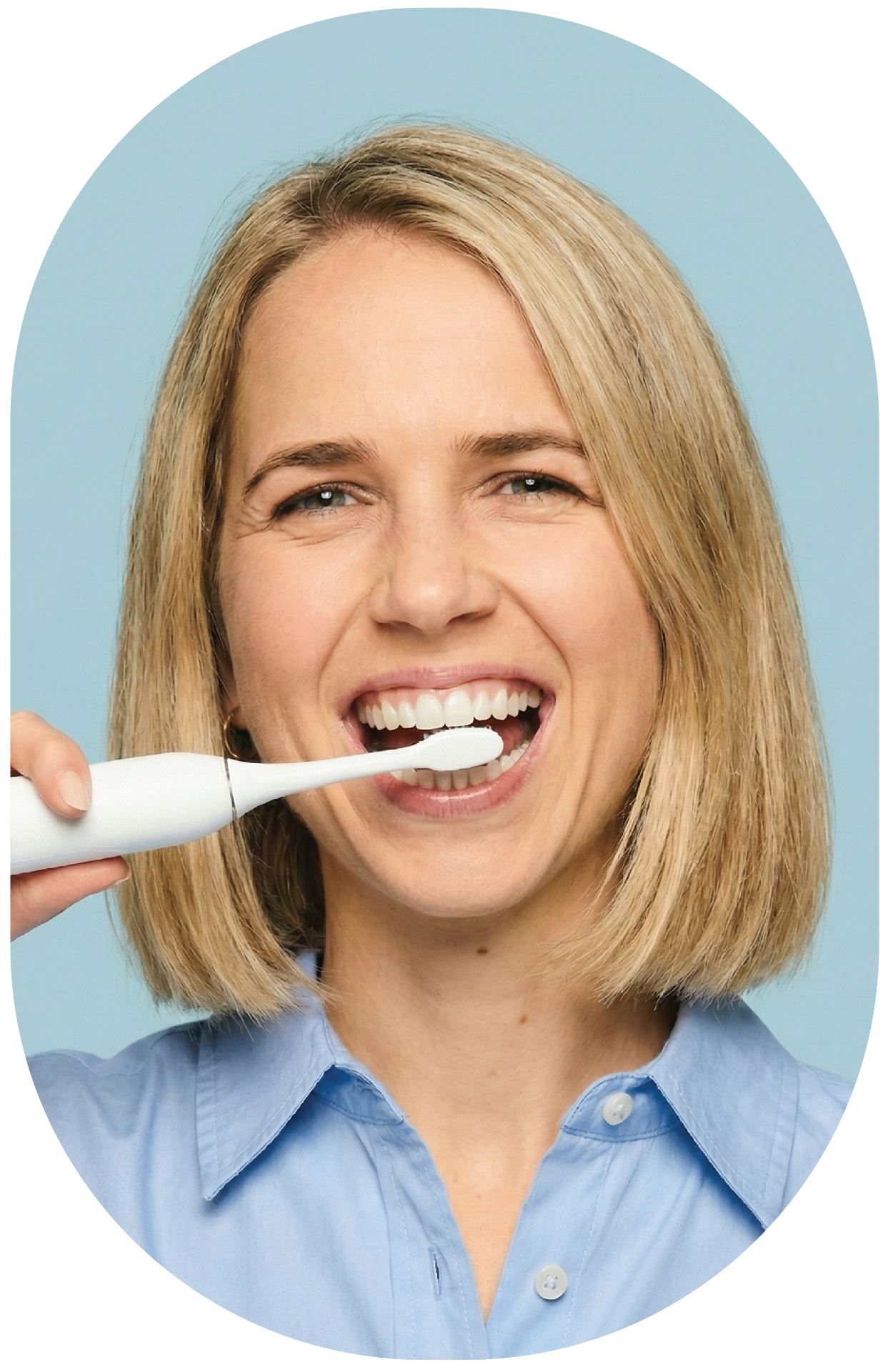 Happy patient brushing teeth